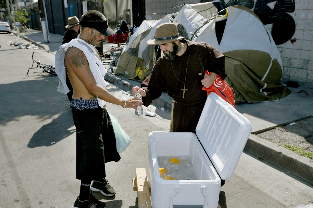 Friars and nuns from Brazil bring food prayer to LA s Skid Row